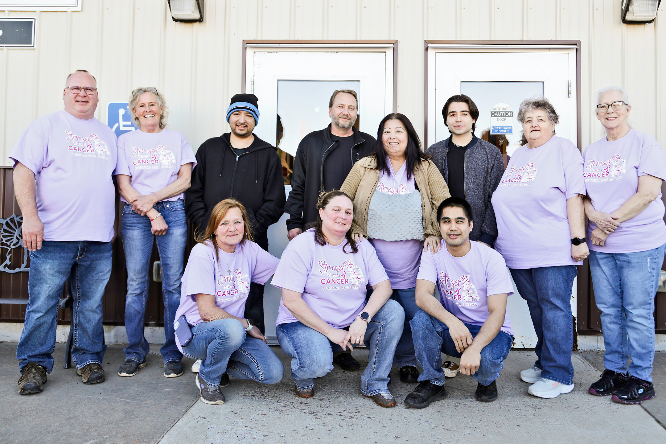 Humm-Dinger employees are shown with their teammate Evelyn Moralez at the “Stronger Than Cancer” Benefit they organized to help her navigate medical expenses as she battles breast cancer. Back row, left to right: Humm-Dinger owner Jason Zacher, Humm-Dinger employee Karin Anderberg, Ronaldo Moralez, Jeremy Stuber, Evelyn Moralez, Ethan Moralez, Humm-Dinger employees Gerri Bader and Dottie Poncelet. Front row, left to right: Tina West, Ellen Tobin, Kevin Phanthavong.
