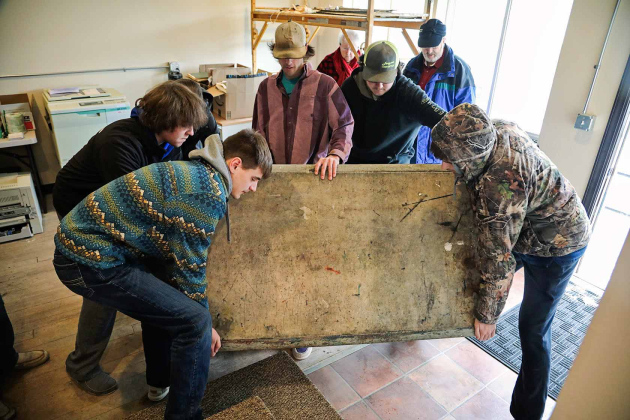 Wessington Springs High School FFA Chapter members lent their braun to carry out and load up the weighty marble top. 