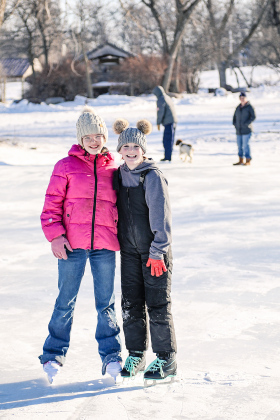Madilyn Gaikowski and Jalene Reiner enjoy the ice skating rink.