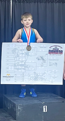 Zayden Wolfcale stands atop the podium after winning 1st in the state in his weight class. PHOTO COURTESY SUMMER SCHOOLER 