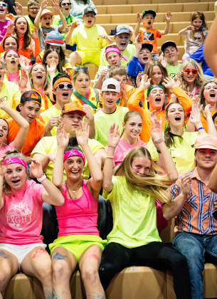 Cheers from the student section were even louder than their neon spirit dress Friday. PHOTO BY RILEY RODUNER