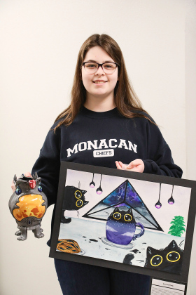 Darcy Ormsmith with her Watercolor titled “Cat Tea Party,” 2nd place and Ceramic sculpture “Forest Brew,” 1st place.