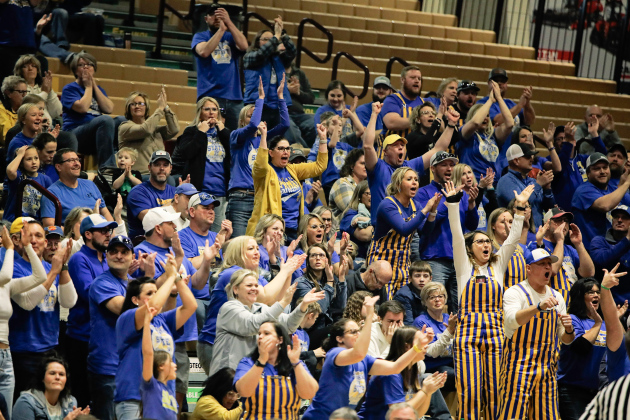 Spartans fans decked out in blue and gold cheer wildly as the Spartans gain the edge over Gregory, catapulting Wessington Springs forward to the consolation championship title. 