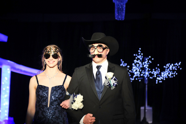 Bailey Yost is escorted by a cleverly disguised Robbie Hine. 